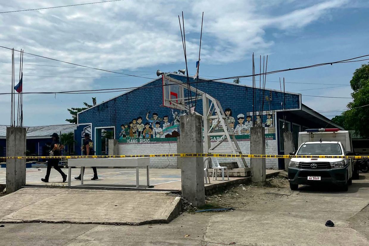 Philippines reels from school shooting as two teenage students arrested in Tacloban attack that kills three