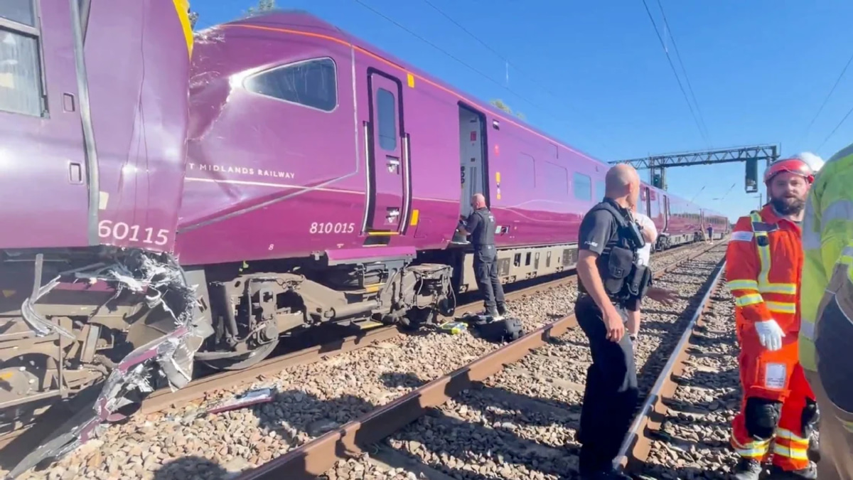 Train collision north of London kills one, injures dozens
