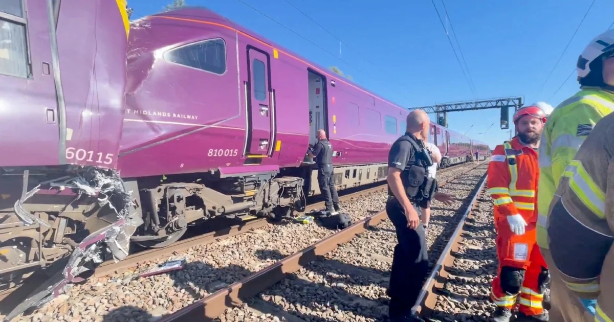 Train collision north of London kills one, injures dozens